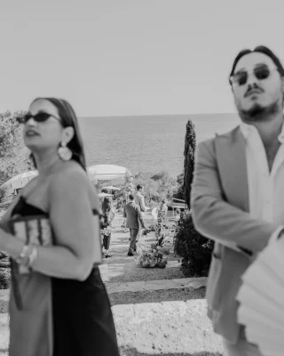 Instagram post: black and white documentary moment at a seaside wedding