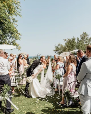 Instagram post: outdoor ceremony surrounded by guests