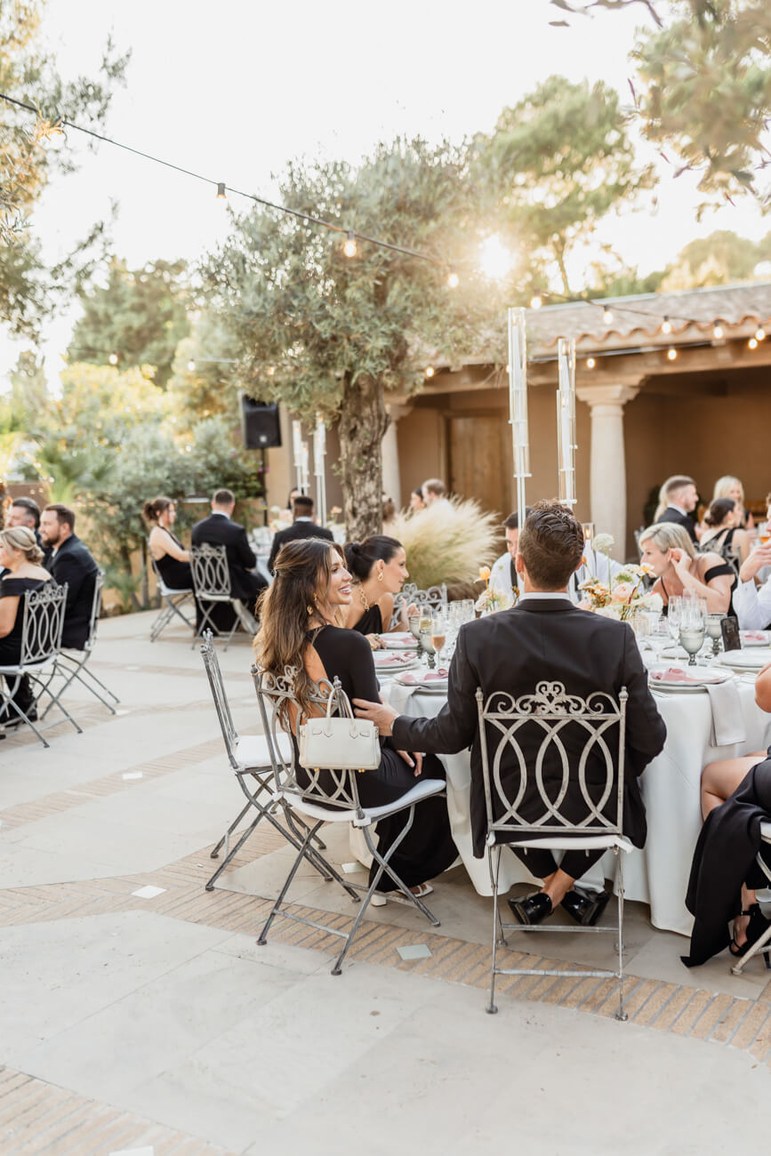 Destination weddings: outdoor reception among olive trees at sunset
